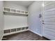 Bright mudroom with custom built-in storage and wood-look flooring at 16141 N 183Rd Dr, Surprise, AZ 85388