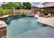 Sparkling pool and spa with stone waterfall, perfect for relaxing at 16141 N 183Rd Dr, Surprise, AZ 85388