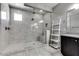 Modern bathroom shower with tile surround, glass door and rainfall shower head at 16141 N 183Rd Dr, Surprise, AZ 85388