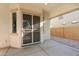 This covered patio offers a secure backyard view through its gated access to the low maintenance landscaping beyond at 16158 W Coronado Rd, Goodyear, AZ 85395