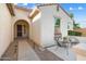 Cozy front courtyard with seating, a decorative rug, and manicured landscaping for outdoor enjoyment at 16158 W Coronado Rd, Goodyear, AZ 85395