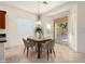 Cozy dining area with modern chairs, stylish pendant lighting, and easy access to backyard at 16158 W Coronado Rd, Goodyear, AZ 85395