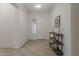 Inviting foyer with neutral tones, tile flooring, and stylish decor creating a welcoming entrance at 16158 W Coronado Rd, Goodyear, AZ 85395