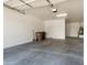 Spacious garage features ample parking and storage space, with a water heater and access door to the home's interior at 16158 W Coronado Rd, Goodyear, AZ 85395