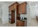 Kitchen features built-in oven, granite counters, and ample cabinet space at 16158 W Coronado Rd, Goodyear, AZ 85395