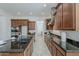 Spacious kitchen with granite counters, stainless appliances, and plenty of cabinet space at 16158 W Coronado Rd, Goodyear, AZ 85395