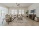 Bright living room with neutral walls, tile flooring, and comfortable furniture for relaxing and entertaining at 16158 W Coronado Rd, Goodyear, AZ 85395
