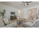 Spacious living area featuring neutral furniture, TV, and seamless access to other rooms at 16158 W Coronado Rd, Goodyear, AZ 85395