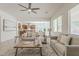 Bright, open living room showcasing neutral color palette and seamless flow to other rooms at 16158 W Coronado Rd, Goodyear, AZ 85395