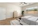 Spacious main bedroom includes a large window and ceiling fan at 16158 W Coronado Rd, Goodyear, AZ 85395