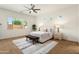Main bedroom with large windows and a ceiling fan at 16158 W Coronado Rd, Goodyear, AZ 85395