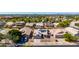 Aerial view of the home with its solar panels and view of the neighborhood at 1634 E Harwell Rd, Phoenix, AZ 85042