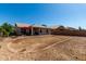 Spacious backyard with a covered patio and ample space for outdoor activities at 1634 E Harwell Rd, Phoenix, AZ 85042