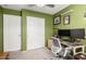 Office/bedroom featuring a desk and chair setup plus storage at 1634 E Harwell Rd, Phoenix, AZ 85042