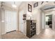 Bright entryway with tile flooring and a convenient shoe rack, offering a welcoming first impression at 1634 E Harwell Rd, Phoenix, AZ 85042