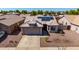 Beautiful single-story home with well-maintained landscaping, a two car garage, and solar panels at 1634 E Harwell Rd, Phoenix, AZ 85042