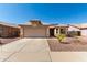 Welcoming home with desert landscaping, spacious driveway, and two-car garage, perfect for a Gathering at 1634 E Harwell Rd, Phoenix, AZ 85042
