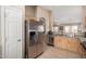 A kitchen featuring stainless steel appliances, granite countertops, and tile flooring for a modern aesthetic at 1634 E Harwell Rd, Phoenix, AZ 85042