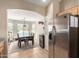 Kitchen view towards the breakfast nook, featuring stainless steel appliances and an open floor plan at 1634 E Harwell Rd, Phoenix, AZ 85042
