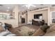 Cozy living room with a faux fireplace, perfect for relaxing and entertaining guests at 1634 E Harwell Rd, Phoenix, AZ 85042