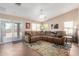 Spacious living room with tiled floors and sliding glass doors, ideal for indoor-outdoor living at 1634 E Harwell Rd, Phoenix, AZ 85042