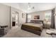 The spacious main bedroom features neutral tones, ample natural light, and an en-suite bathroom at 1634 E Harwell Rd, Phoenix, AZ 85042
