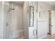 Updated bathroom featuring a glass-enclosed shower with built-in seating and updated fixtures at 18577 W Coolidge St, Goodyear, AZ 85395