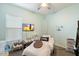Bedroom designed for wellness featuring an accent wall, massage bed, and serene decorations at 18577 W Coolidge St, Goodyear, AZ 85395