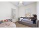 Cozy bedroom with daybed, beanbag, and plenty of room for play; ample natural light at 18577 W Coolidge St, Goodyear, AZ 85395