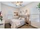 Cozy bedroom featuring a comfortable bed, neutral decor, and natural light from large window at 18577 W Coolidge St, Goodyear, AZ 85395