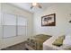 Relaxing bedroom features a twin bed and a soothing nature-themed decor, creating a tranquil personal space at 18577 W Coolidge St, Goodyear, AZ 85395