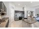 Modern kitchen featuring dark cabinets, stainless steel appliances, and granite countertops at 18577 W Coolidge St, Goodyear, AZ 85395