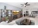 Cozy living room area that flows into the dining and kitchen areas with nice decorations at 18577 W Coolidge St, Goodyear, AZ 85395