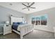 Serene main bedroom featuring a large window with views of the outdoor patio and backyard at 18577 W Coolidge St, Goodyear, AZ 85395