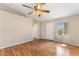 This open living room features wood flooring, a ceiling fan and a vaulted ceiling at 20428 N 32Nd Ln, Phoenix, AZ 85027