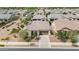 Aerial view of a single-story home with desert landscaping, a tile roof, and solar panels at 21104 E Poco Calle --, Queen Creek, AZ 85142