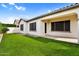 Backyard with turf grass, patio and green hedge landscaping at 21104 E Poco Calle --, Queen Creek, AZ 85142