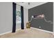 Bright bedroom with natural light, a whimsical gallery wall, and stylish neutral decor at 21104 E Poco Calle --, Queen Creek, AZ 85142