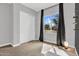 Neutral bedroom featuring a view, large window, and modern light for a warm and inviting ambiance at 21104 E Poco Calle --, Queen Creek, AZ 85142