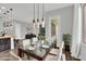 Dining room with modern lighting fixture and a glass table with seating for six at 21104 E Poco Calle --, Queen Creek, AZ 85142