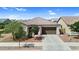 Charming single-story home with a tile roof, a two-car garage, and desert landscaping at 21104 E Poco Calle --, Queen Creek, AZ 85142