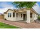 Backyard with covered patio, desert landscaping, offering privacy and outdoor enjoyment at 22040 N 119Th Dr, Sun City, AZ 85373