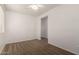 Bright, carpeted bedroom features a ceiling fan and an open doorway at 22040 N 119Th Dr, Sun City, AZ 85373