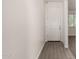 Clean, bright entryway with wood-look tile flooring and white door at 22040 N 119Th Dr, Sun City, AZ 85373