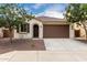 Charming single-story home with a well-manicured yard and a two-car garage at 22040 N 119Th Dr, Sun City, AZ 85373