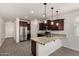 Modern kitchen with stainless steel appliances, granite countertops and a breakfast bar at 22040 N 119Th Dr, Sun City, AZ 85373