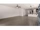 Spacious open concept living area featuring tile floors with backyard and kitchen views at 22040 N 119Th Dr, Sun City, AZ 85373