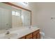 A well-lit bathroom features a double sink vanity, a large mirror, and a shower-tub combo at 2210 N 27Th Pl, Phoenix, AZ 85008