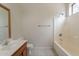 A well-lit bathroom is equipped with a single sink vanity and a shower-tub combo at 2210 N 27Th Pl, Phoenix, AZ 85008