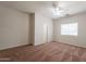 The bedroom is bathed in natural light with a ceiling fan for added comfort at 2210 N 27Th Pl, Phoenix, AZ 85008